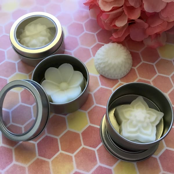 lotion bars in metal canisters