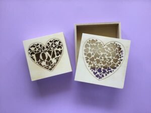 wooden craft boxes on a purple background