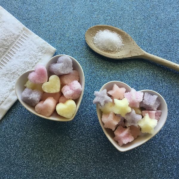 colored epsom salt gems in heart-shaped bowls