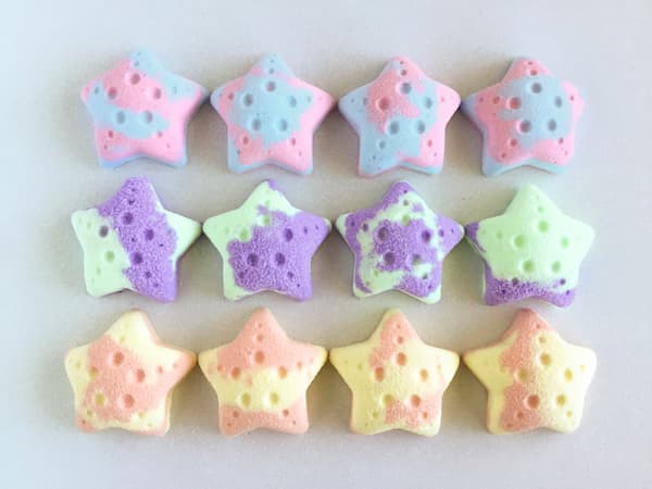 starfish bath bombs in three different colors and scents