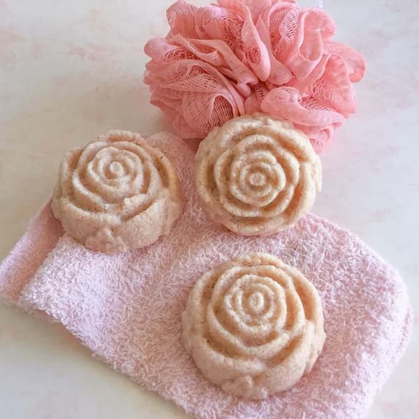 three rose shaped pink salt cakes for the bath