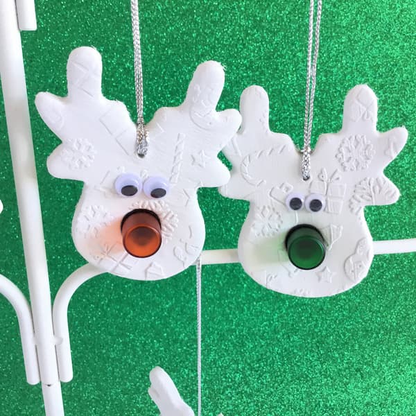 clay reindeer ornaments with orange and green noses