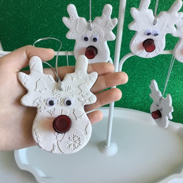 unscrewing vial from reindeer diffuser ornament
